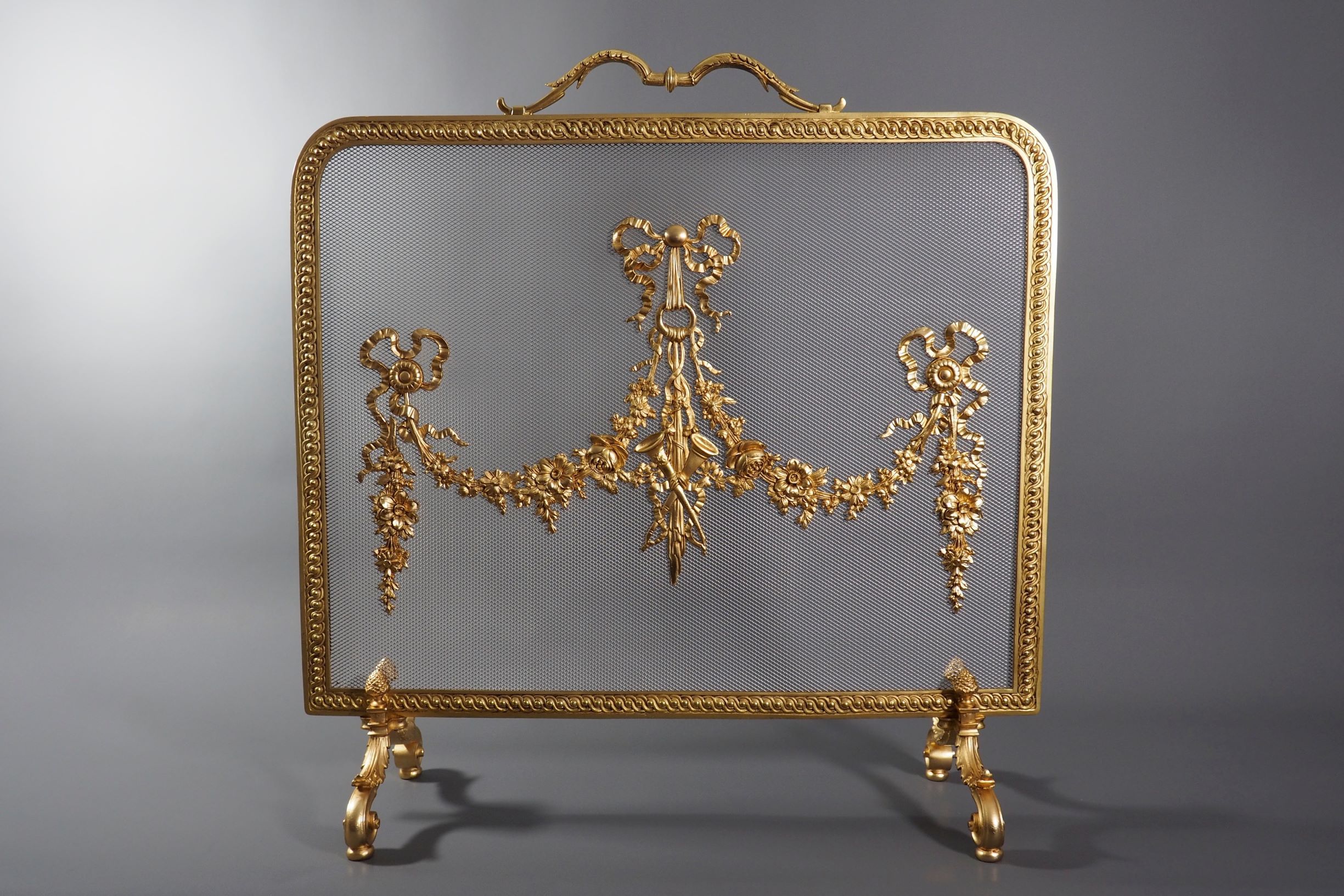 Pare feu en bronze doré