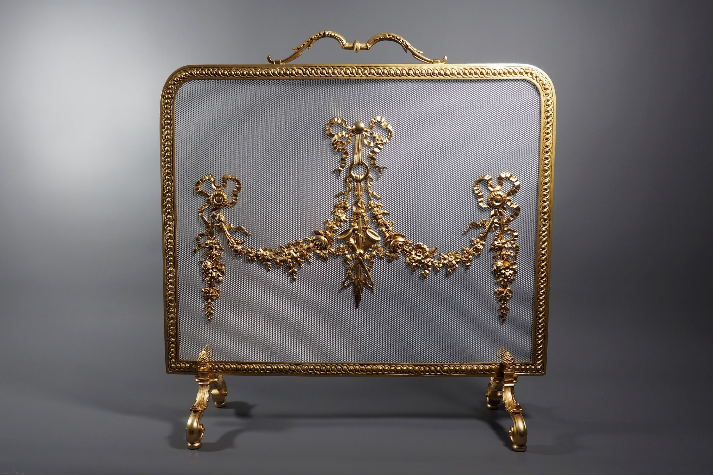 Pare feu en bronze doré